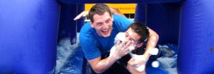 Two young men having fun in the bubbles