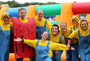 A team dressed as Minions at a charity event
